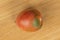 Fresh tomato de barao on light wood