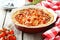 Fresh tomato pie on a grey wooden background