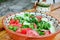 Fresh tomato salad in traditional bulgarian plate