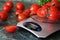 Fresh tomatoes on kitchen scales weighing