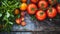 Fresh tomatoes with water droplets on a wooden surface