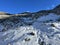 Fresh tracks on the season\\\'s first early autumn snow above the road pass Fluela (Fluelapass)