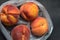 Fresh tree ripened peaches in plastic grocery store produce bag