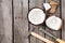 Fresh tropical coconut with instruments on wooden background