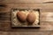 Fresh tropical fruits in a wooden box on a wooden background