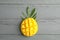 Fresh tropical ripe mango on grey background