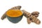 Fresh turmeric and powdered turmeric bowl close-up on white background