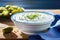 Fresh tzatziki with cucumber in white bowl