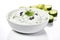 Fresh tzatziki with cucumber in white bowl