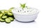 Fresh tzatziki with cucumber in white bowl