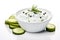 Fresh tzatziki with cucumber in white bowl isolated