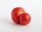 Fresh ugly red farm tomato on white background. Trendy vegetarian vegetables. Healthy food