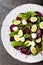 Fresh vegetable salad with boiled beet, mangold leaves, walnuts and quail eggs