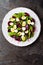 Fresh vegetable salad with boiled beet, mangold leaves, walnuts and quail eggs