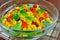 Fresh vegetable salad with corn, lamb`s lettuce, chilly, sweet pepper