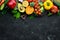 Fresh vegetables on a black background. Avocados, tomatoes, potatoes, paprika, citrus. Top view.