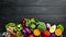 Fresh vegetables on a black background. Vegetarian food. Top view.