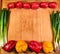 Fresh Vegetables Border On Wood Cutting Board