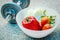 Fresh Vegetables in a bowl and dumbbells