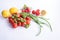 Fresh vegetables, chives, lemons, basil and fresh tomatoes on a table