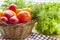 Fresh vegetables covered with water drops in basket.