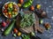 Fresh vegetables on dark background - broccoli, tomatoes, peppers, beets, eggplant, radish. Vegetarian table.