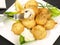 Fresh Vegetables - Fried Champignon Mushrooms with Garlic Sauce on a Plate