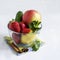 Fresh vegetables and fruits in a glass bowl. Strawberry, apple, cucumber, lemon and mint.