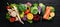 Fresh vegetables and fruits. Organic food on a black wooden background.