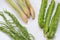 Fresh vegetables and herbs on white plate