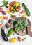 Fresh vegetables on a light background - broccoli, tomatoes, peppers, beets, eggplant, radish. Cooking background.