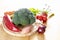 Fresh vegetables like broccoli, bell pepper, onions and more on a wooden cutting board, ingredients for healthy cooking, copy