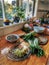 Fresh vegetables prepared for cooking on a polished wooden kitchen bench