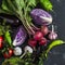 Fresh vegetables - red cabbage, beets, eggplant, peppers, garlic, tomatoes, herbs on a dark background. Raw ingredients.