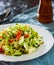 Fresh vegetables salad with cabbage, tomato and cucumber in plate