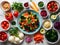 fresh vegetables and spices on wooden table for making salad