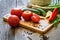 fresh vegetables tomatoes, cucumber, chili pepers, dill on wooden background.