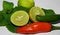 Fresh vegetables on white background,lemons and chilies on the Mint leaves,red and green chilies