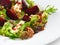 Fresh vegetarian gourmet salad with baked beetroot and cheese