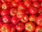 Fresh, vivid red tomatoes closeup