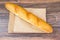 Fresh warm baguette in paper bag