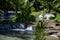Fresh water river and tropical plants. Tropical nature landscape with waterfall river and forest. Jungle lake