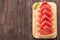 Fresh watermelon pieces placed on wooden background