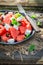 Fresh watermelon salad with feta, olives and mint leaves