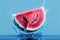 Fresh Watermelon splash in blue background, water drops