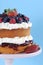 Fresh whipped cream and berries layer sponge cake - vertical.