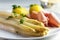 Fresh white asparagus dish with potatoes and ham, light background, close-up