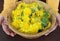 Fresh whole dandelion plant with roots, flower and leaves in a wooden bowl, make ready for tea. Herbalism concept, alternative