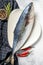 Fresh whole Japanese amberjack. Raw Fish Yellowtail. Gray background. Top view