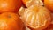 Fresh whole and peeled mandarin close up